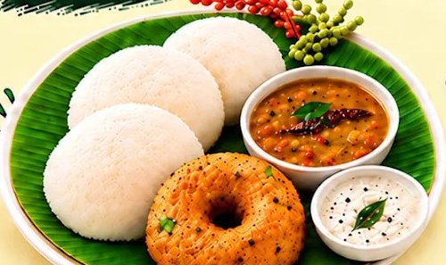 Soft idlis and a crispy vada with sambar and coconut chutney